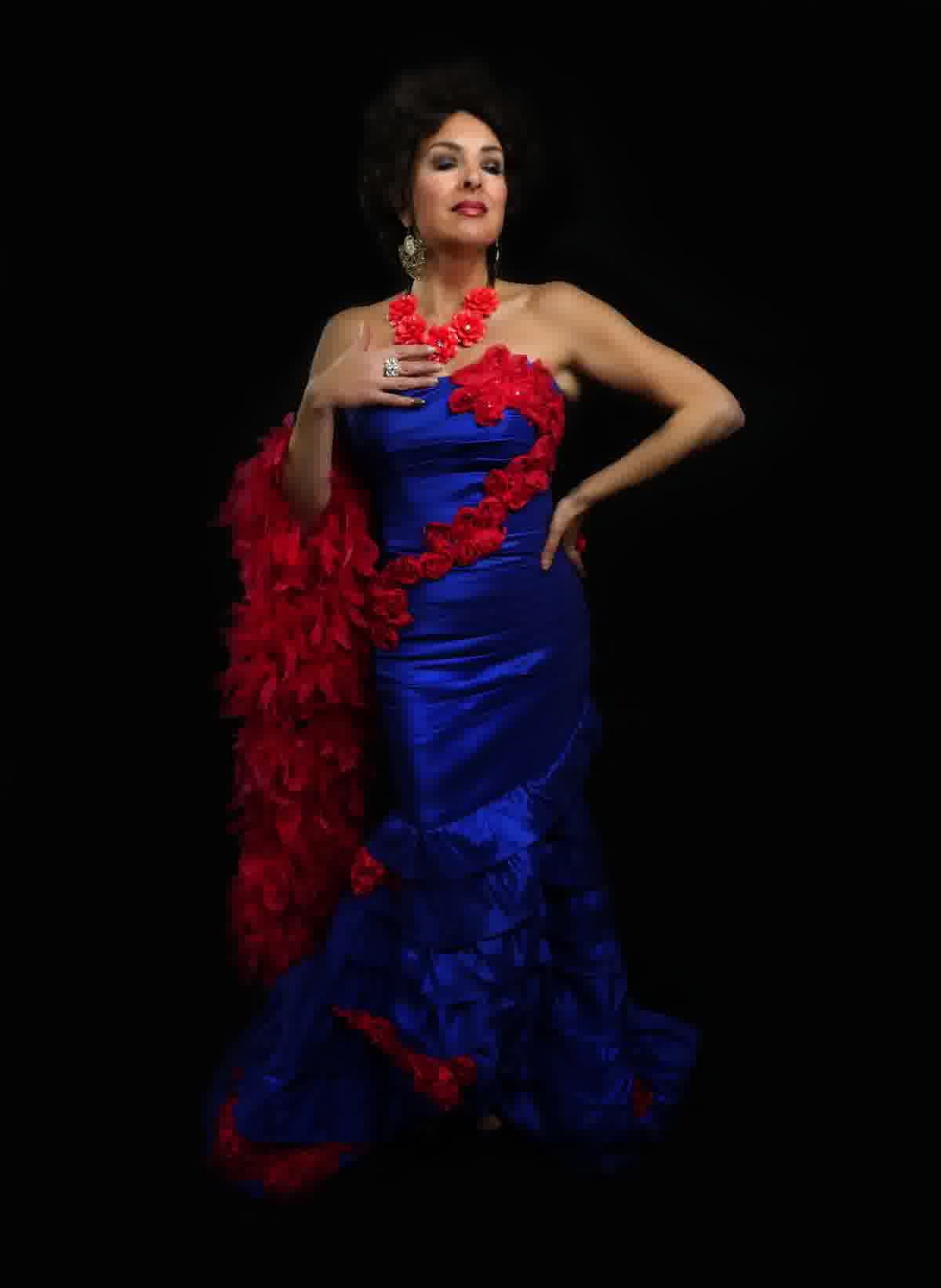 Aurora in a blue couture gown with red roses
