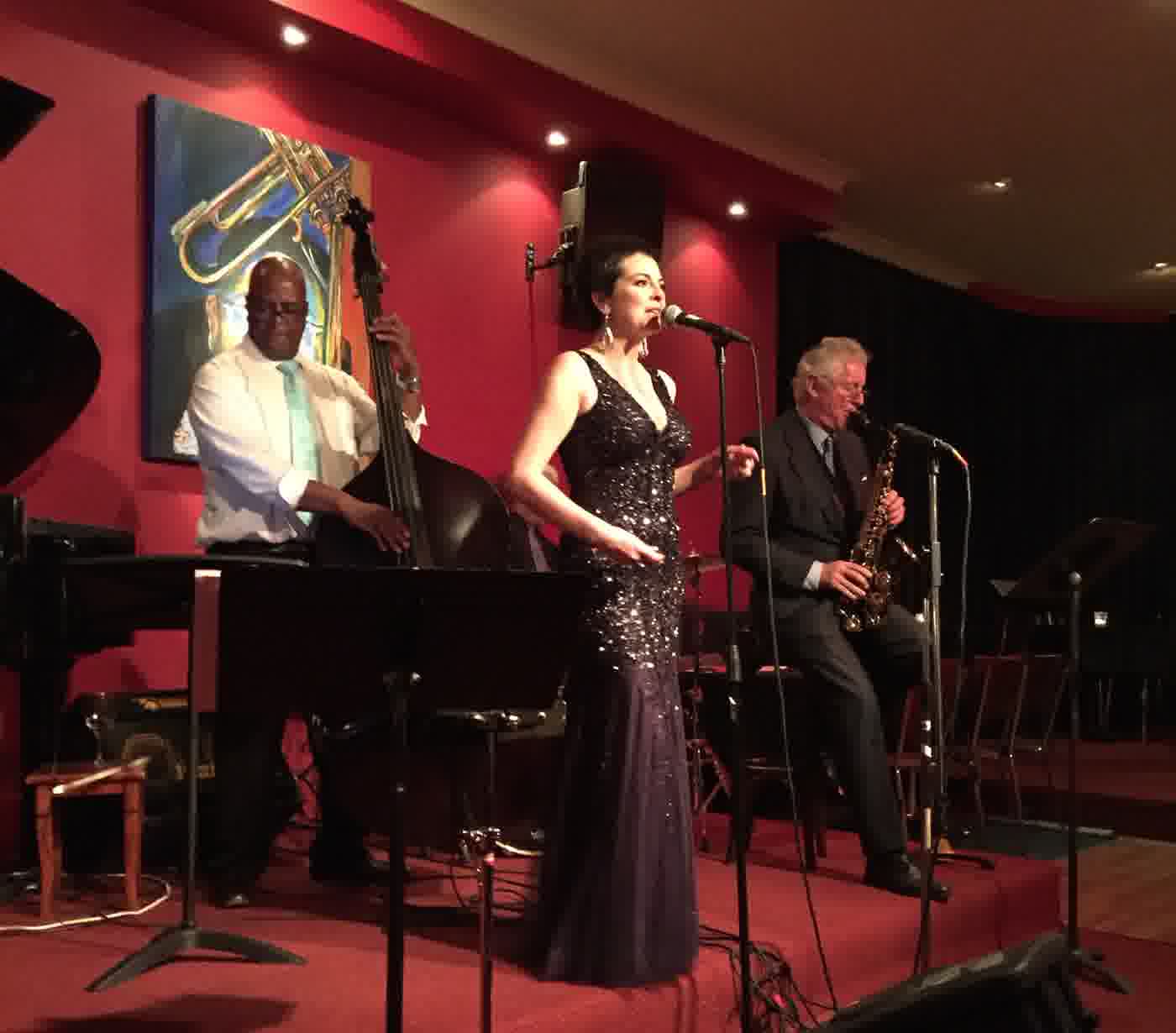 Aurora singing live with bass and sax
